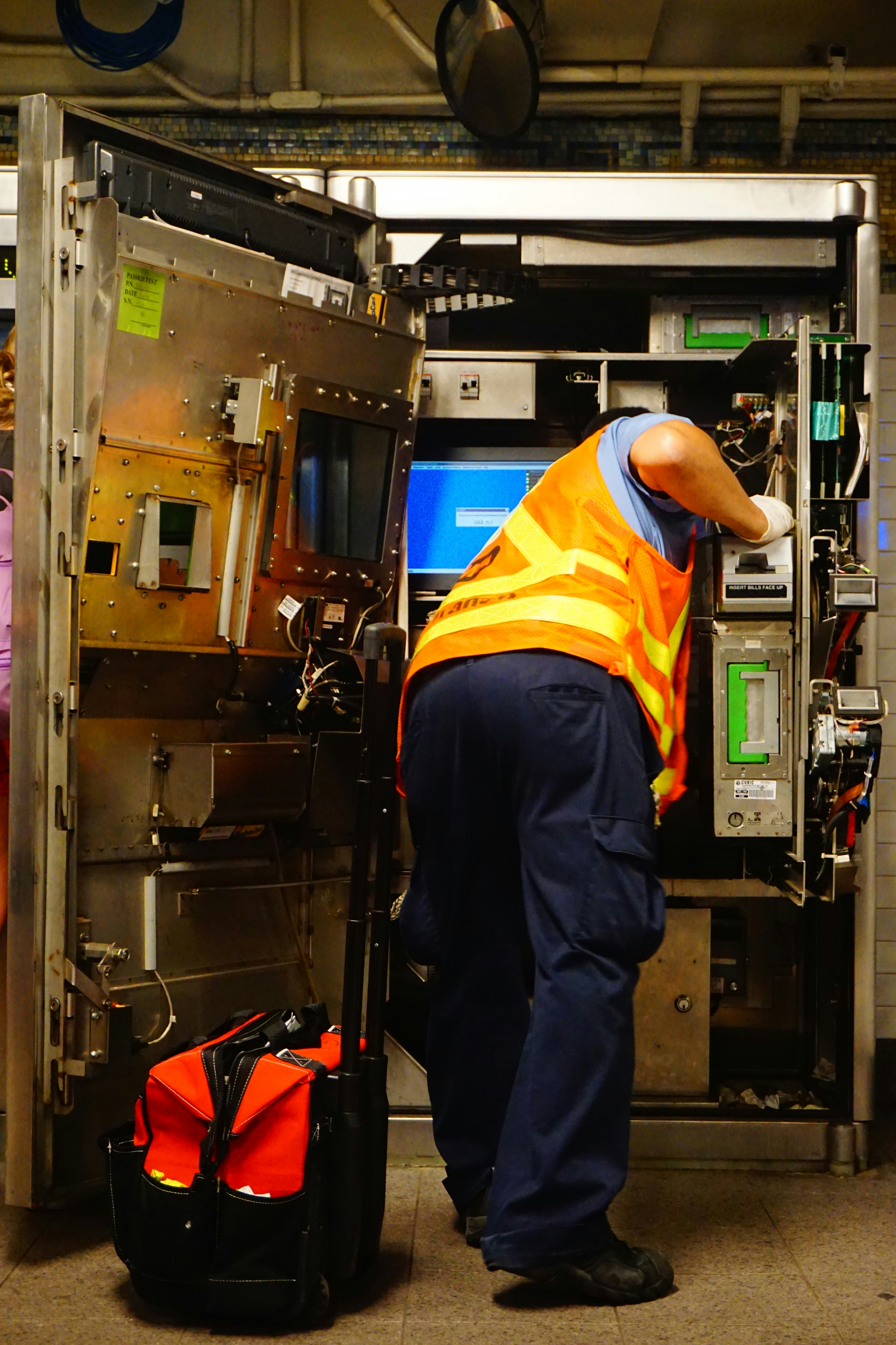Field technician servicing industrial equipment
